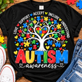 Black autism awareness shirt with colorful puzzle-piece heart tree