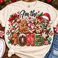 I'm the Sassy One Christmas candy and cookie graphic on a cream shirt